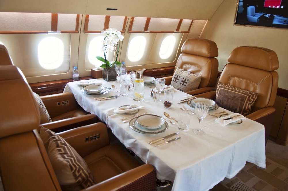 dinner served in luxurious jet airplane
